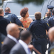 A topless protester wearing body paint is arrested by police as Bill Cosby arrives at the Montgomery County Courthouse for the first day of his sexual assault retrial on April 9, 2018, in Norristown, Pa.